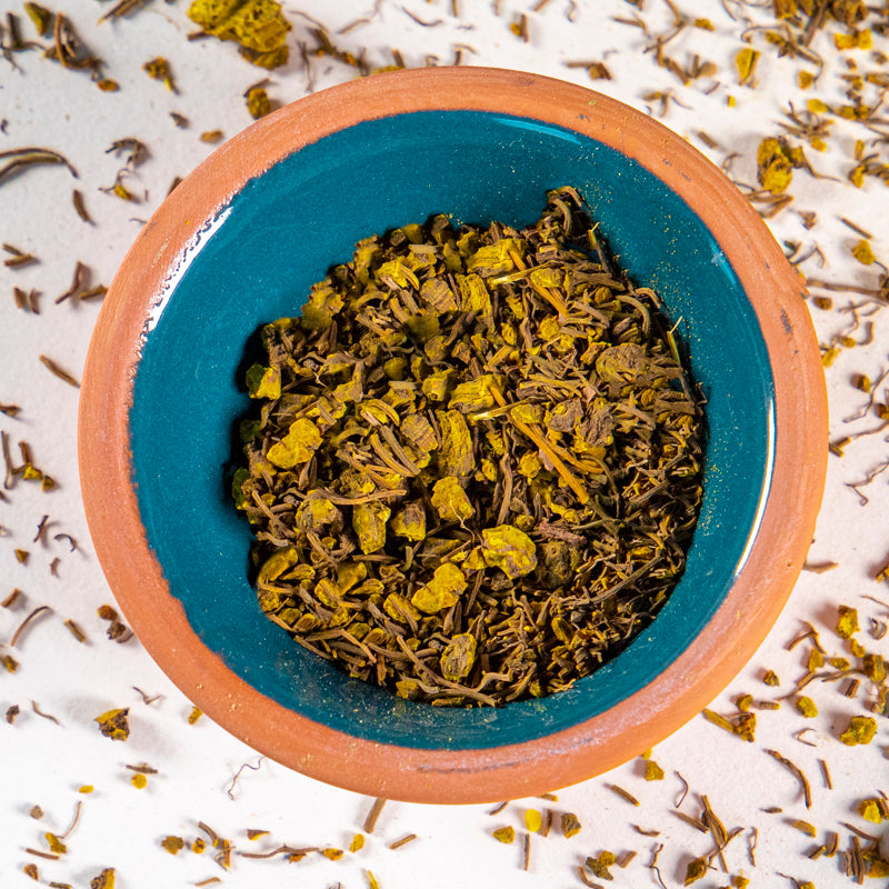 Golden Seal Root herb in blue clay bowl with white background and herb surrounding.